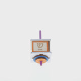 Spinning colored dreidel