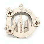 Decorative ornament with 'NY 2026' and cityscape design on a white background