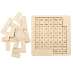 Handmade birch wood daily calendar puzzle board shown with its precision laser-cut pieces set to the side."