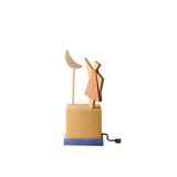 Wooden hand-cranked music box depicting a young girl with a crescent moon on a white background