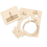 Wooden cutouts of Nassau Hall Princeton and 2 tigers  on a white background