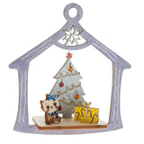 Colored  ornament depicting a cat with xmas tree and present on white background