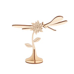 Decorative item composed of a flower and a small dragonfly