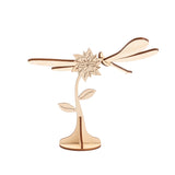Decorative item composed of a flower and a small dragonfly