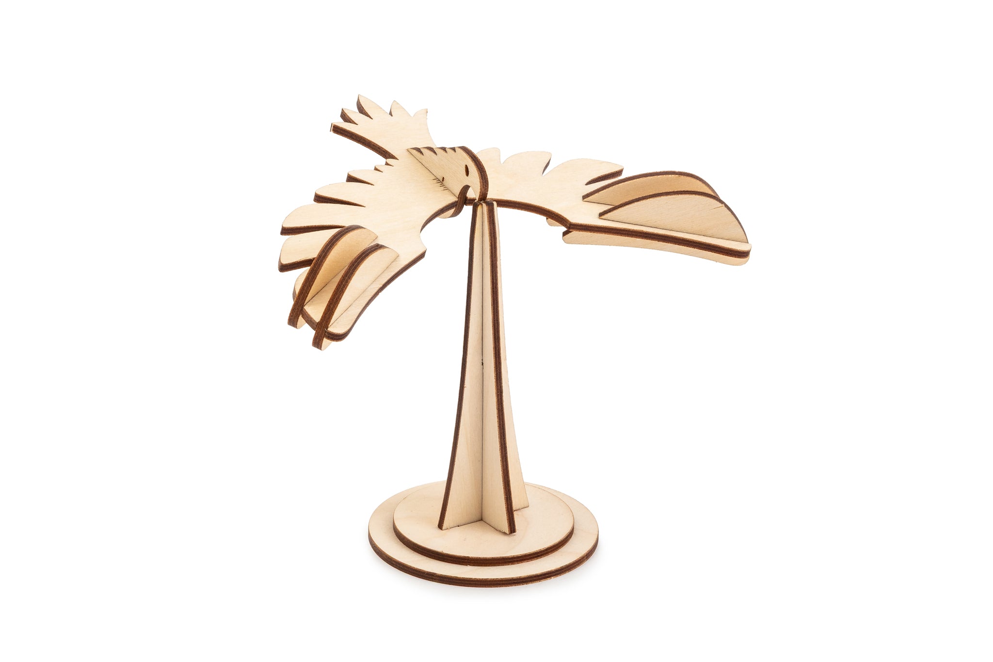 Laser cut eagle balancing on a stand with white background