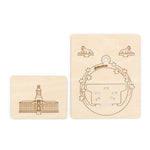 Two wooden cards illustrating Nassau Hall and 2 tigers on a white background