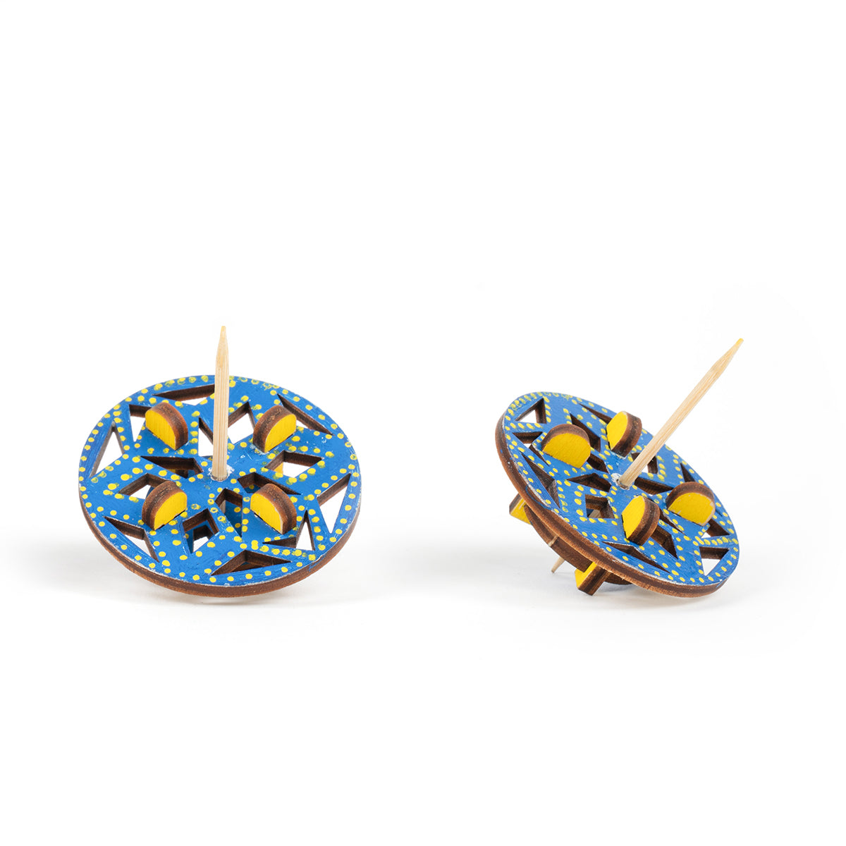Diamond mosaic spinning top colored in with blue and yellow patterns on a white background