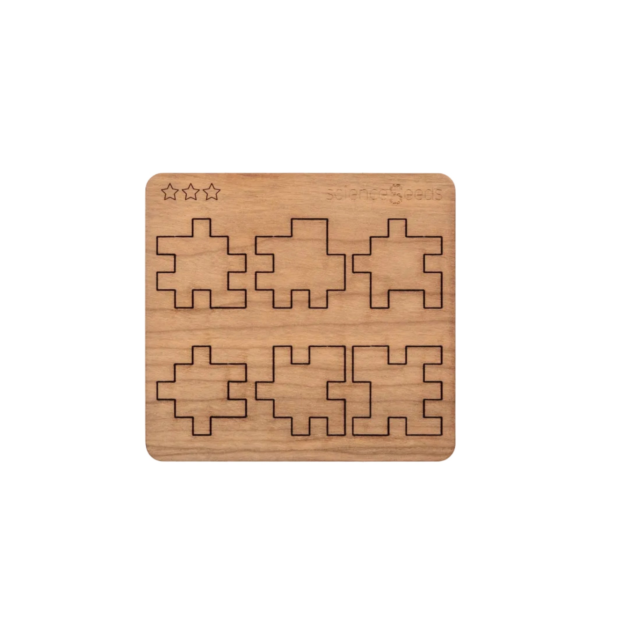 Laser-cut wooden pieces and components of the CubeMaster Pro 3D cube puzzle shown on board