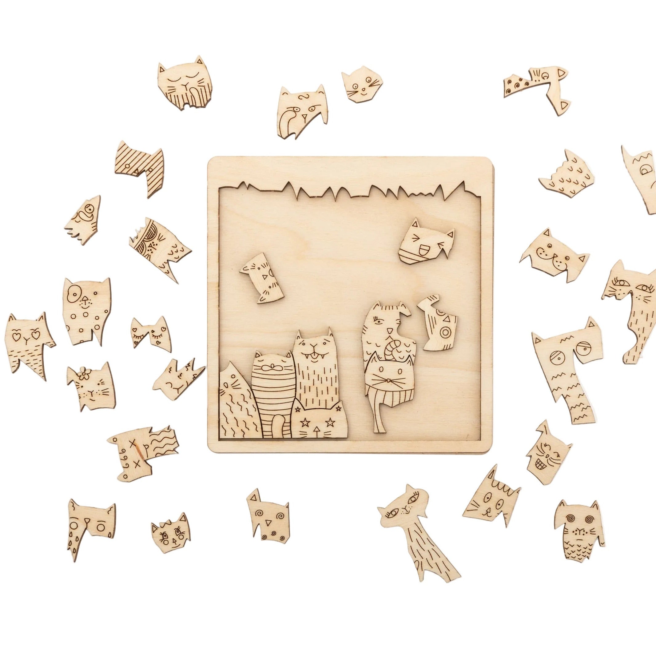 "For the Purrfect Fit" cat jigsaw puzzle with several pieces on the board and loose pieces surrounding the frame