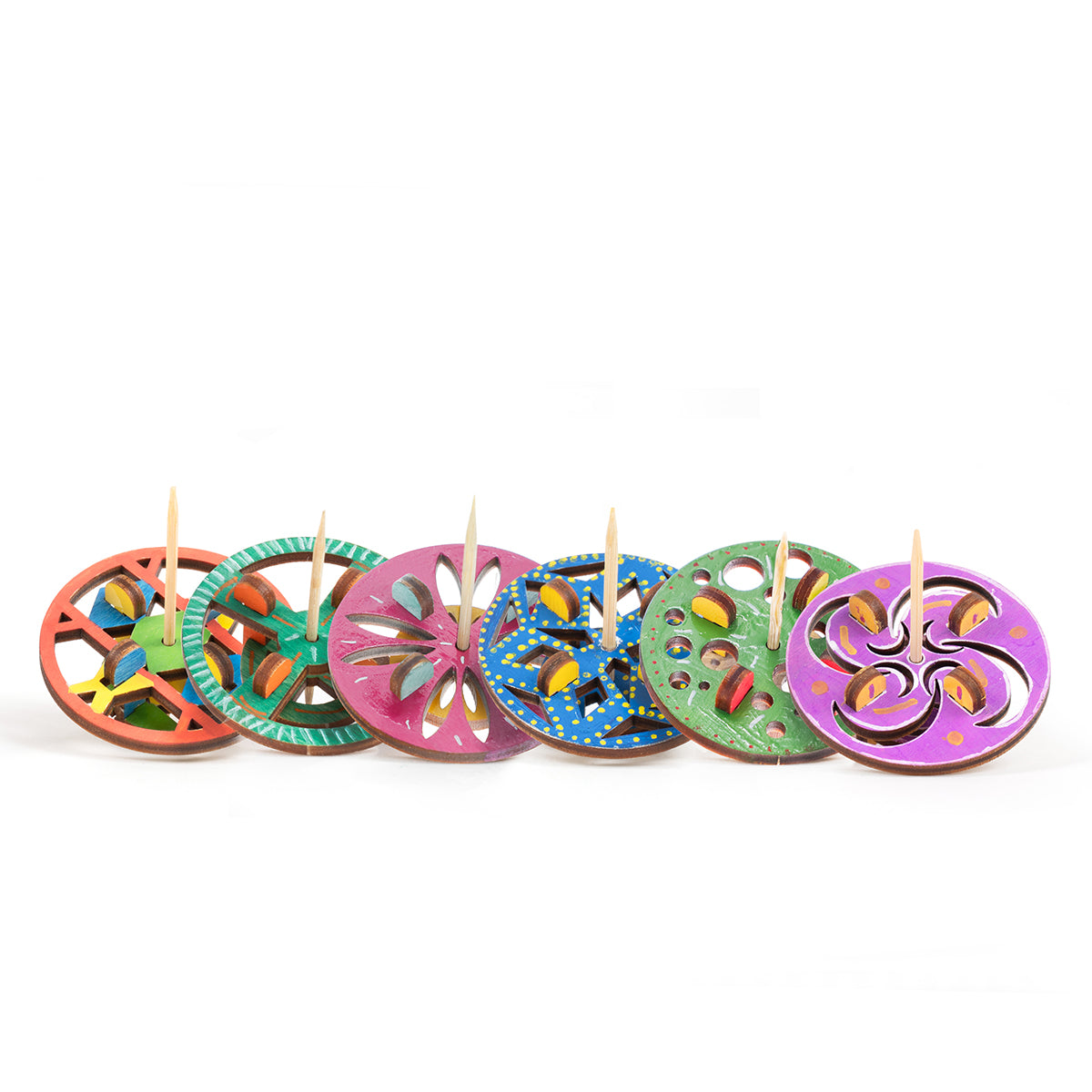 Colorful wooden discs with holes and toothpicks on a white background