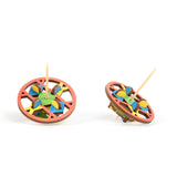 triangle wooden spinning top shown front and tilted on a white background